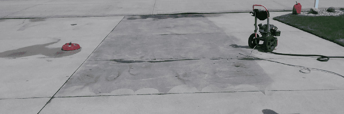 A driveway with obvious clean and dirty sections